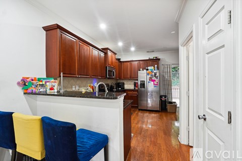 A kitchen with wooden cabinets and a white countertop.