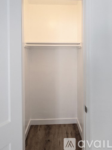 A white door with a small window above it.