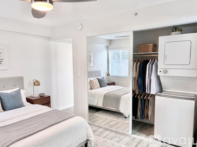 A bedroom with a large bed and a wardrobe.
