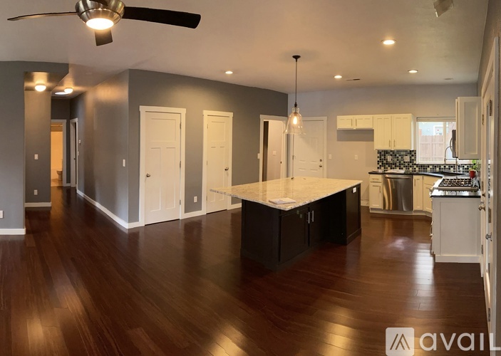A kitchen with a large island in the middle of the room.