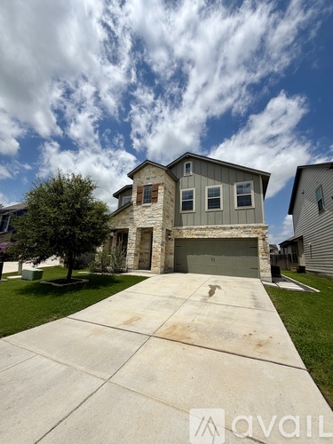 A house with a driveway in front of it.
