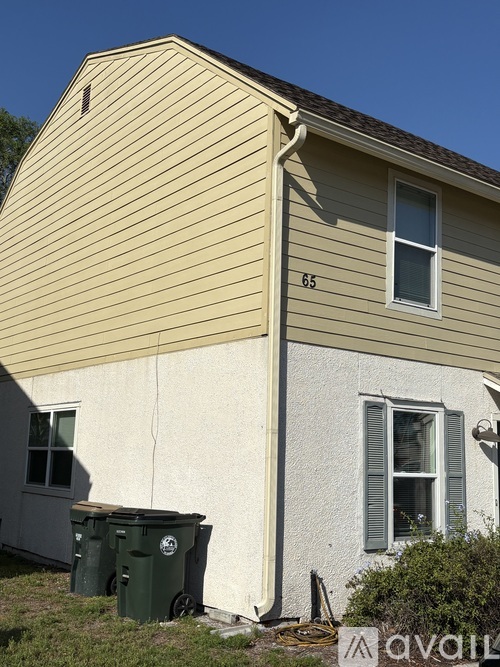 A house with the number 65 on the side.
