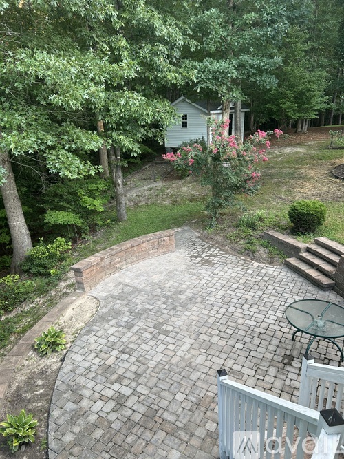 A patio with a table and chairs and a sign that says "love".