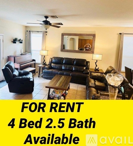 A living room with a couch, chair, and coffee table is for rent.