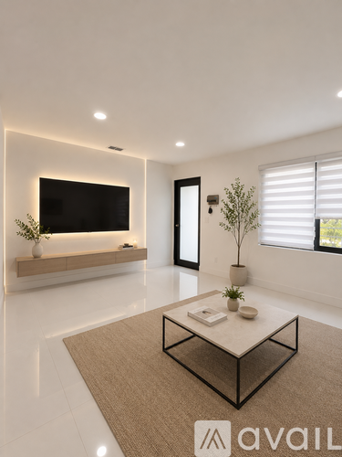 A modern living room with a flat screen TV mounted on the wall.