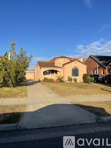 A house with a driveway in front of it.