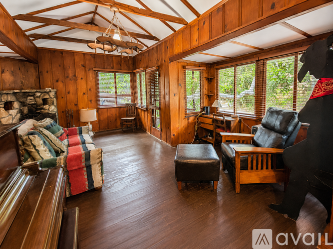 A living room with wooden floors and furniture.