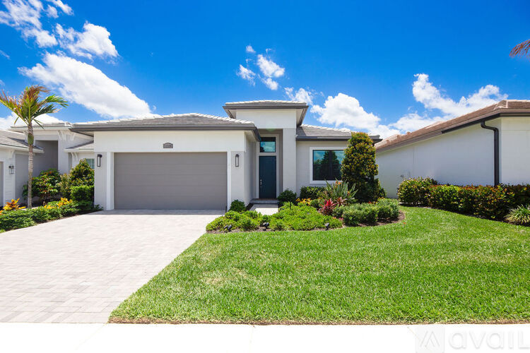 A house with a driveway and a garage door.