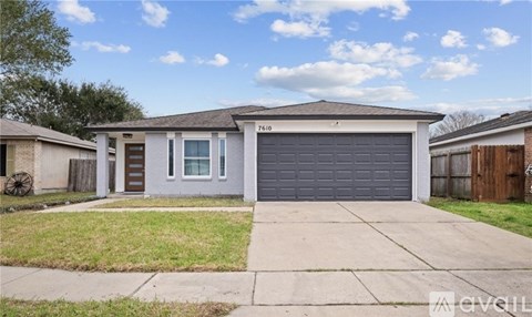 A two-story house with a garage door that says "7610" on it.