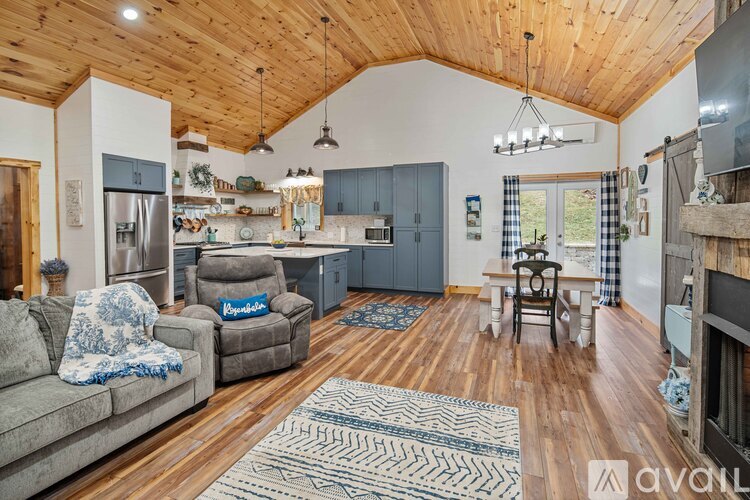 A living room with a couch and a chair.