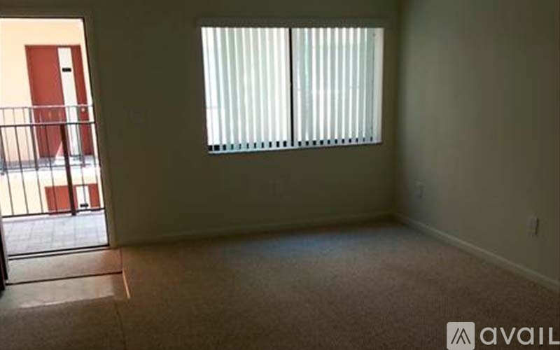 A room with a window and a door.
