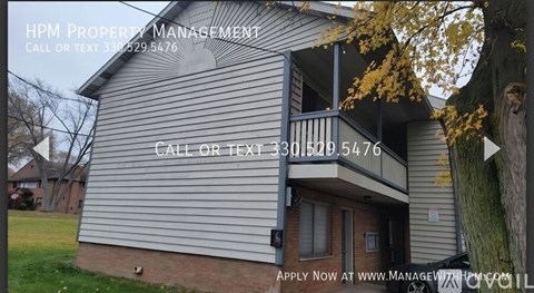 A house with a sign for HPM Property Management on the side.