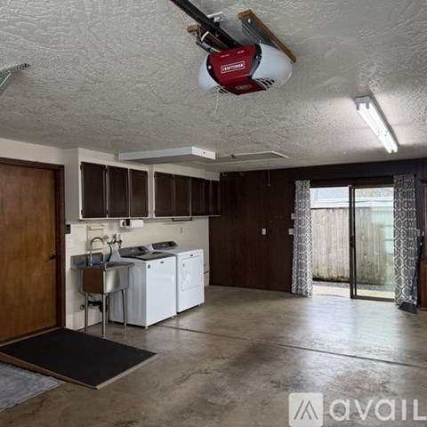 A kitchen with a washing machine and a dishwasher.
