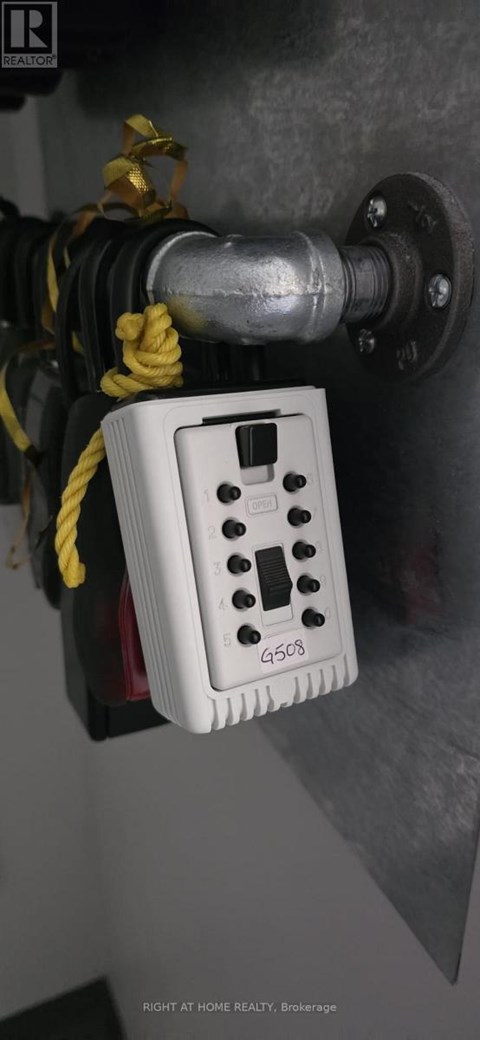 A white electrical outlet box with the label G503 is attached to a wall.