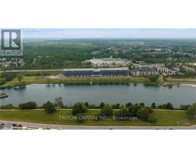 A brokerage company logo is on an aerial shot of a lakefront property.