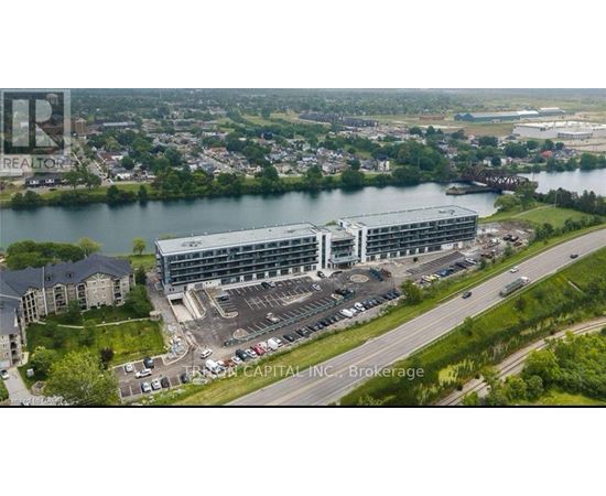 A large building with a parking lot in front of it.