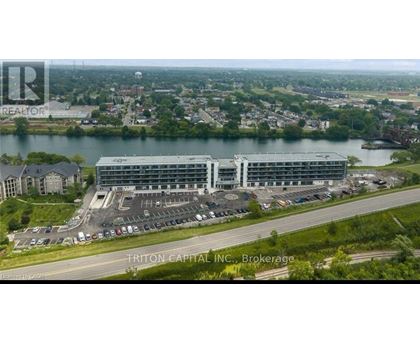 A large building complex with a parking lot in front, situated in a suburban area.