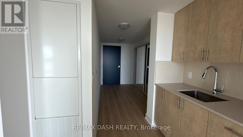 A kitchen with a sink and cabinets.