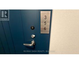 A blue door with a silver handle and a numbered panel on the right.