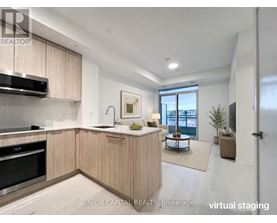 A modern kitchen with wooden cabinets and stainless steel appliances.