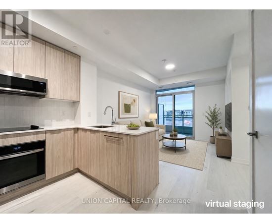 A modern kitchen with wooden cabinets and stainless steel appliances.
