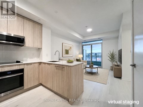 A modern kitchen with wooden cabinets and stainless steel appliances.