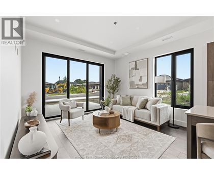 A living room with a large window and a view of the outside.