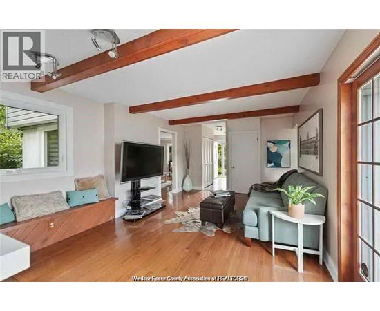 A living room with a television and a couch.