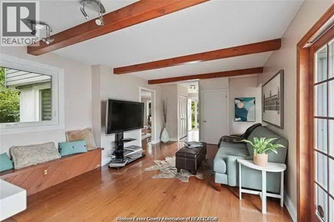 A living room with a television and a couch.