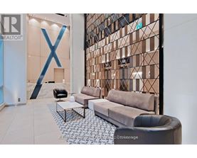 A modern living room with a large X-shaped decoration on the wall.