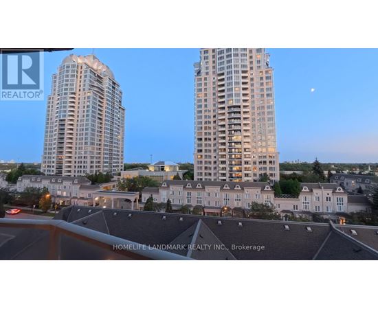 Two high-rise buildings are seen in the distance with a moon in the sky.