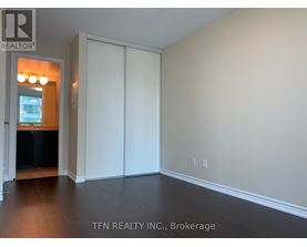 A room with a sliding door and a window.