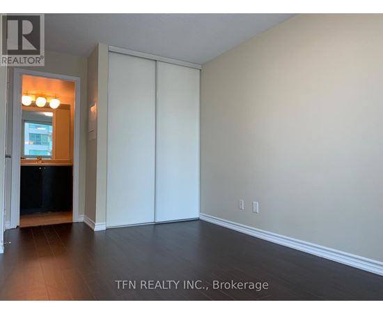 A room with a sliding door and a window.