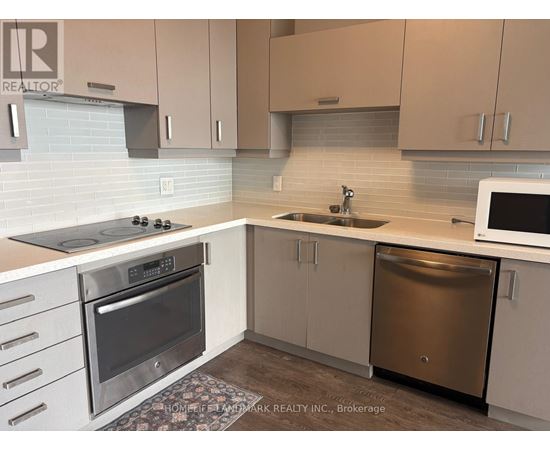 A kitchen with a stove top oven, microwave, and dishwasher.