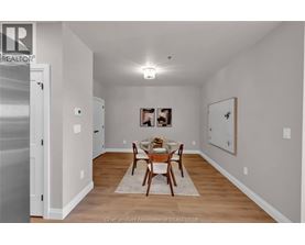 A dining room with a table set for two.