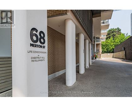 A sign for 68 Merritt Street stands in front of a building.