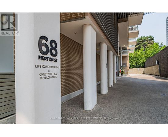 A sign for 68 Merritt Street stands in front of a building.