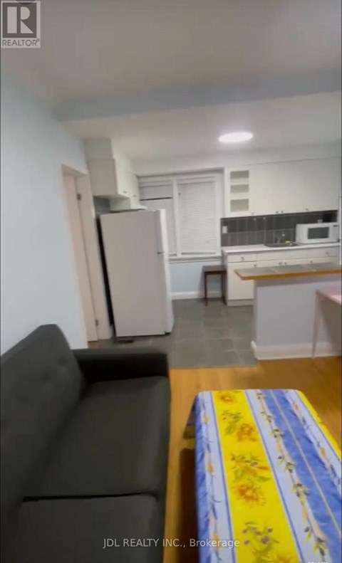 A living room with a couch and a table.