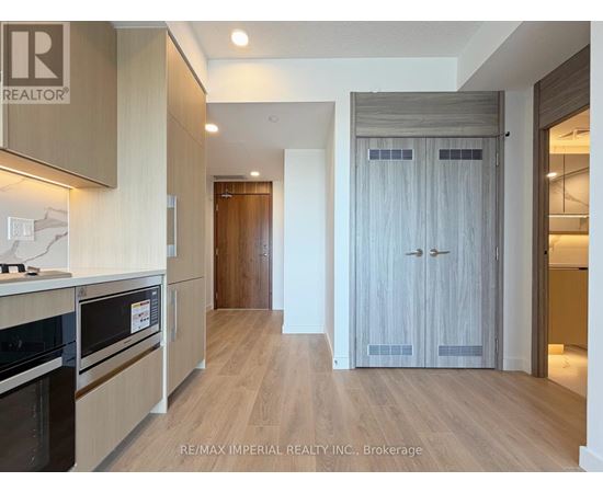 A kitchen with a stove top oven and a microwave.
