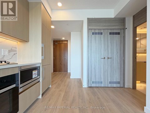 A kitchen with a stove top oven and a microwave.