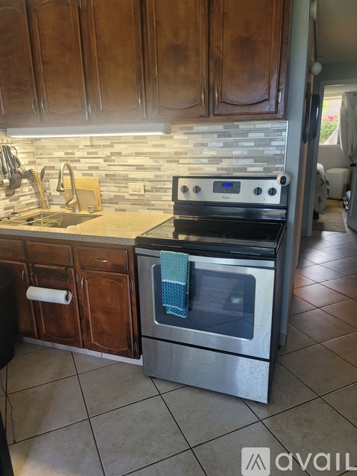 A modern kitchen with a stove and oven.