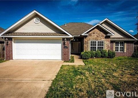 A house with a white garage door is for sale.