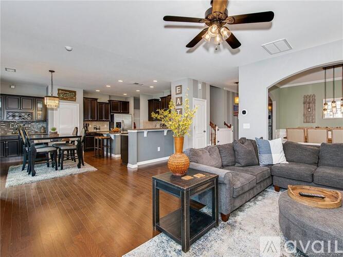 A living room with a grey sofa and a wooden coffee table.