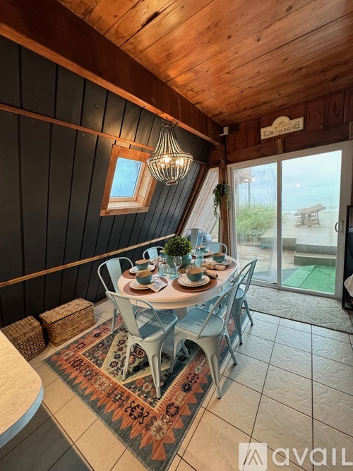 A dining area with a table set for four.