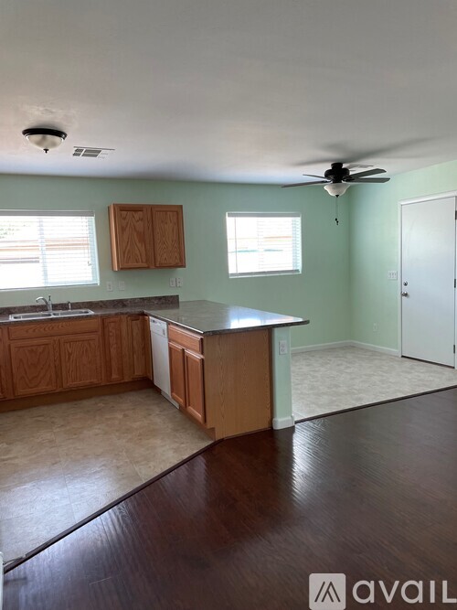 A kitchen with wooden cabinets and a countertop.