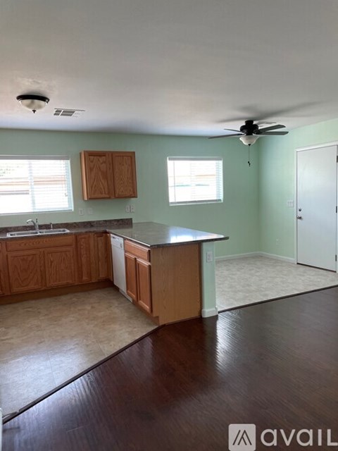 A kitchen with wooden cabinets and a countertop.
