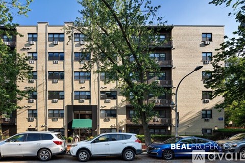 A building with the sign "BEALL PROPERTIES" on a car in front.