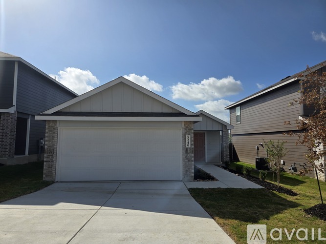 A house with a garage is for sale.