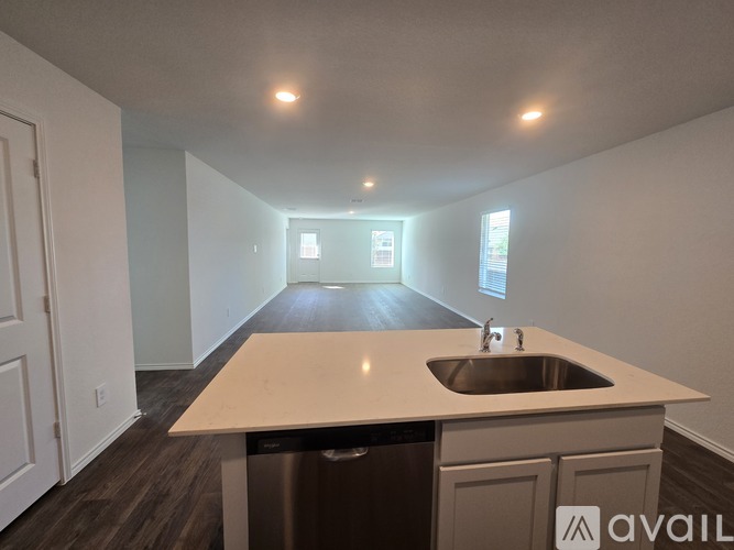 A kitchen with a sink and a countertop is available for rent.