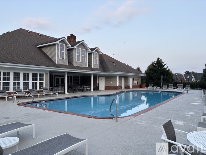 A large house with a pool in the backyard.